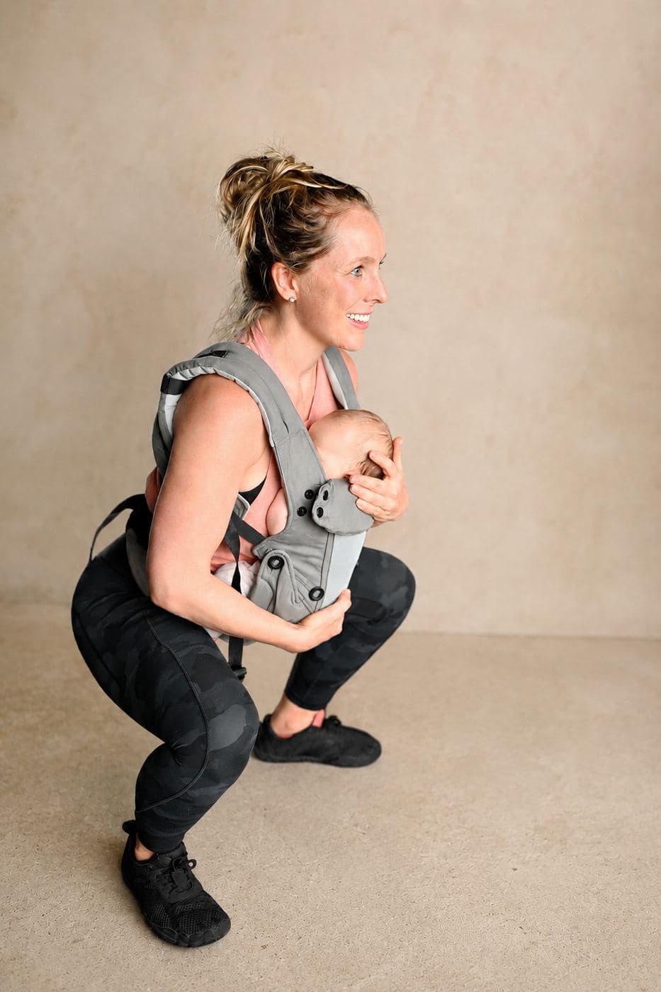 Madeleine Gray conducting a babywearing-friendly holistic personal training session